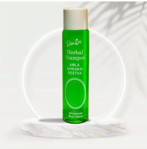 Herbal shampoo bottle with natural Amla ingredients for healthy scalp and hair care.